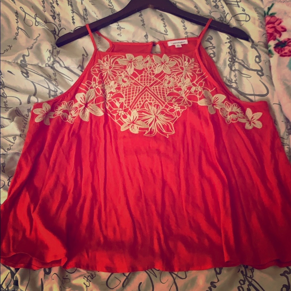 Red tank top with white flower pattern